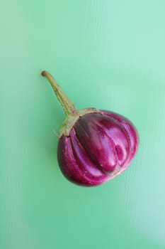 Purple Eggplant on green background