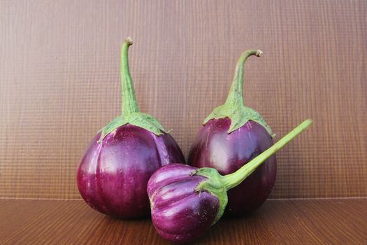 Purple Eggplant on wooden background