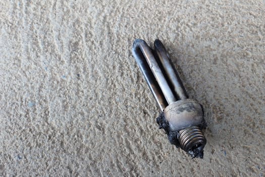 burn Compact Fluorescent Lamp on the floor