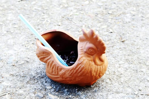 pottery for drink in chicken shape.