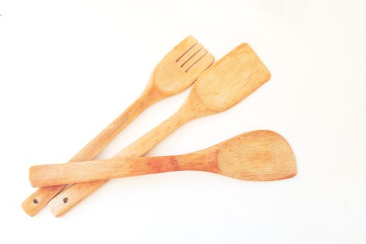 wooden kitchen tools on white background.