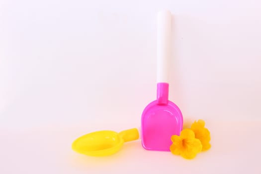 Two plastic kitchen toy on white background.