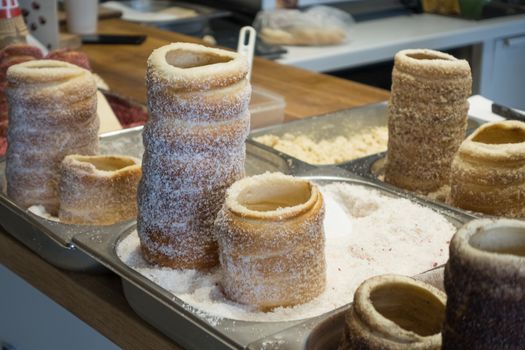 Hungarian and Czech Twist Roll. Hungarian "Kurtoskalacs ", Czech "Kurtos" prepared on the grill, at a traditional street food market.