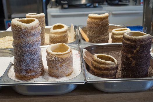 Hungarian and Czech Twist Roll. Hungarian "Kurtoskalacs ", Czech "Kurtos" prepared on the grill, at a traditional street food market.