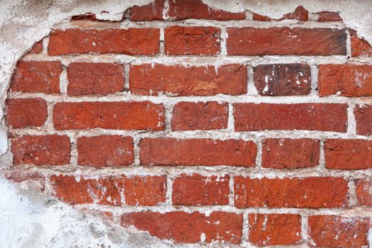 Background from old brick wall of ancient building, frame from plaster. Close-up. Copy space.