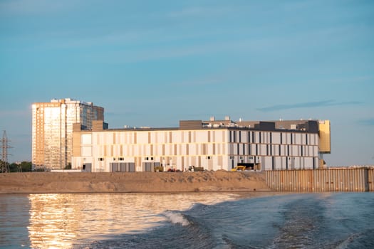 View of the city of Khabarovsk from the Amur river. Urban landscape in the evening at sunset