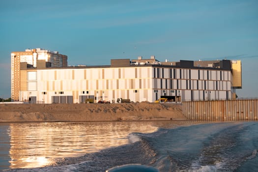 View of the city of Khabarovsk from the Amur river. Urban landscape in the evening at sunset