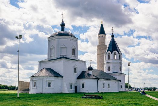 Dormition Church and Big Minaret of Cathedral Mosque on Background. Bolghar, Russia.