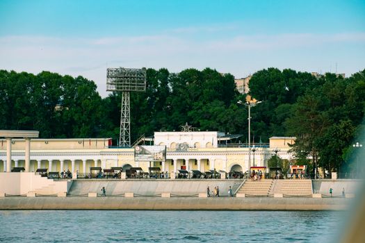 View of the city of Khabarovsk from the Amur river. Urban landscape in the evening at sunset