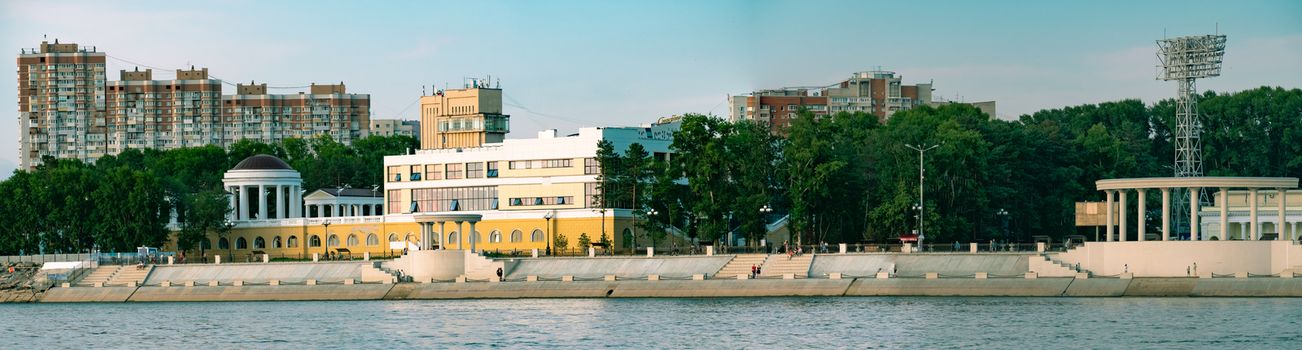 View of the city of Khabarovsk from the Amur river. Urban landscape in the evening at sunset