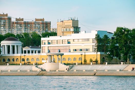 View of the city of Khabarovsk from the Amur river. Urban landscape in the evening at sunset