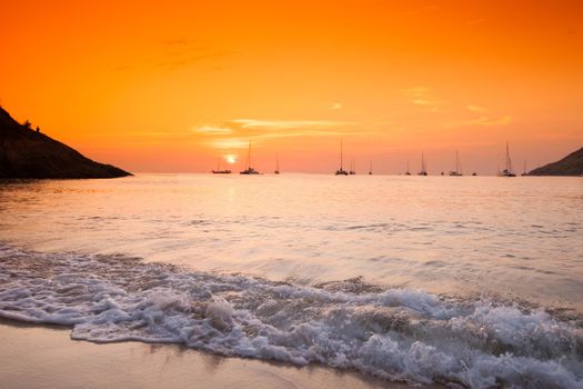 Beautiful sunset with orange sky over blue sea