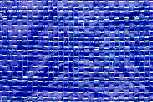 Texture of blue plastic net bag. Concept of recycle product or global warming.