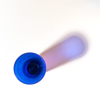 Some blue glasses on a white surface
