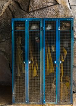 historical miner lockers with work outfits, Nostalgic work equipment, Historic work place in a mine