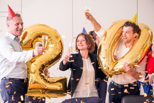 Business people celebrating 2020 New Year at office party