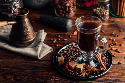 Cezve and Glass of Coffee with Beans, Refined Sugar and Oriental Spices.