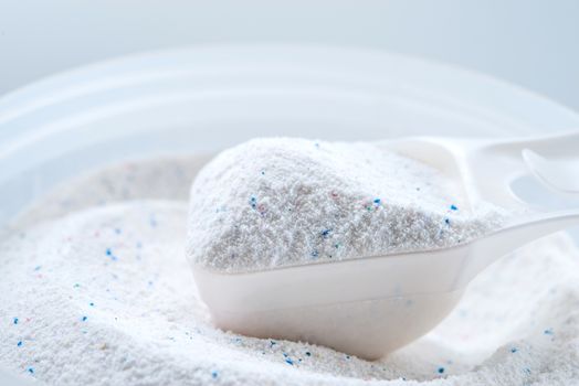 washing powder with measuring cup on a washing powder box