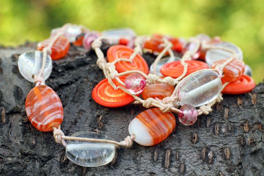 Wooden glass beads hand made eco style on the wooden background