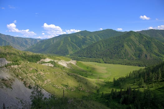 Picturesque fertile valley surrounded by high mountains. Altai, Siberia, Russia