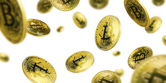 Gold Bitcoin coins flying on a white background.