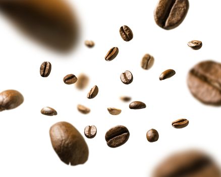 Coffee beans in flight on white background.