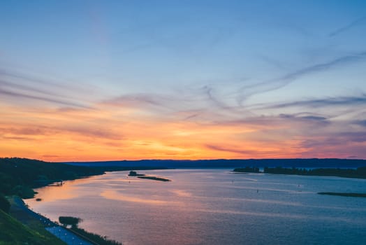 Beautiful summer sunset on the river shore.