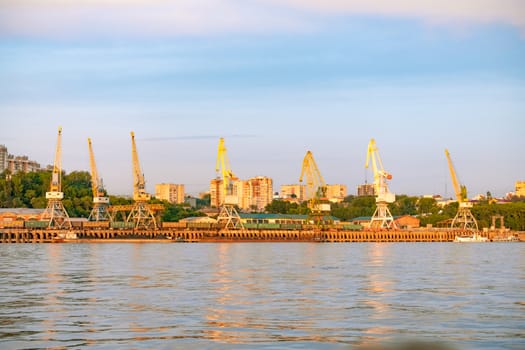 View of the city of Khabarovsk from the Amur river. Urban landscape in the evening at sunset