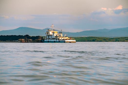 View of the city of Khabarovsk from the Amur river. Urban landscape in the evening at sunset