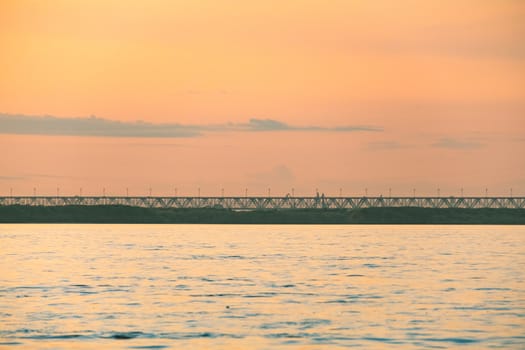 View of the city of Khabarovsk from the Amur river. Urban landscape in the evening at sunset