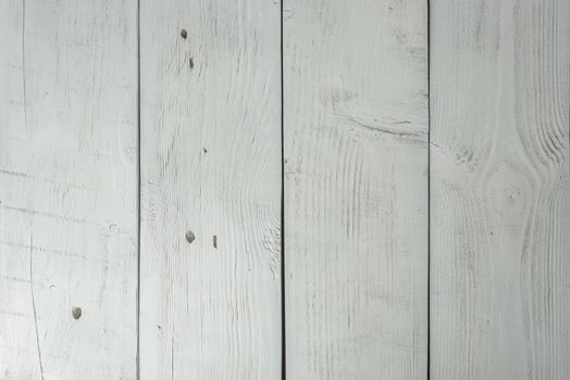 Colored wooden planks with cracks and scratches, background or texture