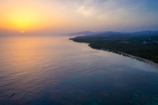 Aerial view of tropical beach at sunrise.Samana peninsula,Bahia Principe beach,Dominican Republic.