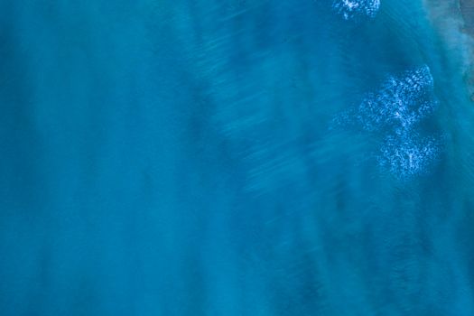 Blue surface of sea water, shot in the open sea directly from above