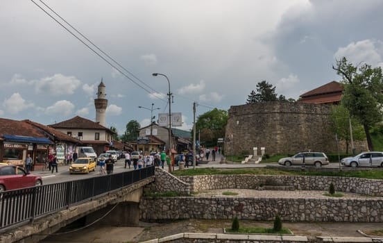 Novi Pazar, Serbia - May 5, 2018: City center with and fortress ruin and mosque. Novi Pazar, town of southern Serbia.
