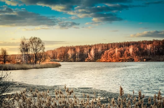 Spring landscape with melting ice on the lake on a clear day.