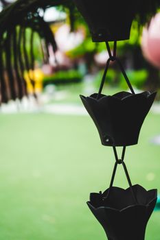 rain chain element architecture roof old temple garden japanese metal.rain chain japan design architecture closeup style vintage outdoor building asian. asia rain iron chain hanging, selected focus.