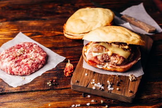 Cheeseburger on Cutting Board with Beef Patty.