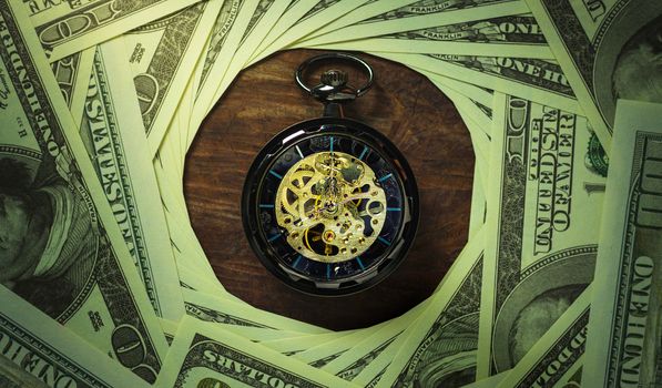 Pocket watch and dollar banknote stacking in darkness background. Concept of Time is money or Business.