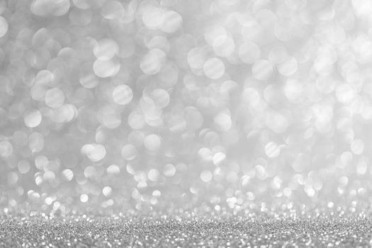 Abstract shining glitters silver holiday bokeh background with copy space for text