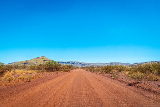 Dirt road at Karijini National Park leading towards Mount Bruce Australia
