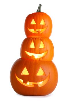 Stack of glowing Halloween Pumpkins isolated on white background