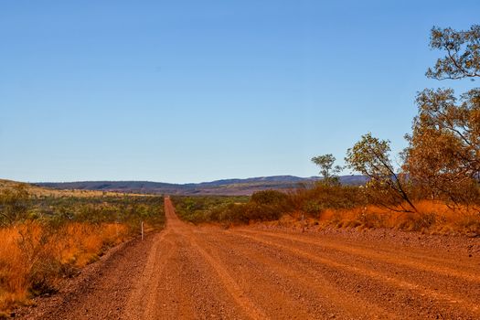Gravel road towards Mount Bruce at Karijini National Park Australia