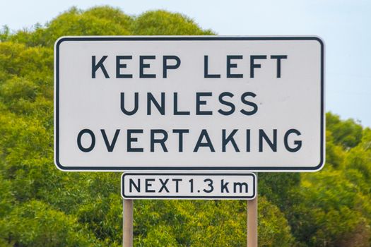 Keep left unless overtaking street sign in Australian bush