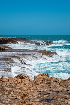 Quobba Blow Holes waves flooding coast during windy weather in Australia