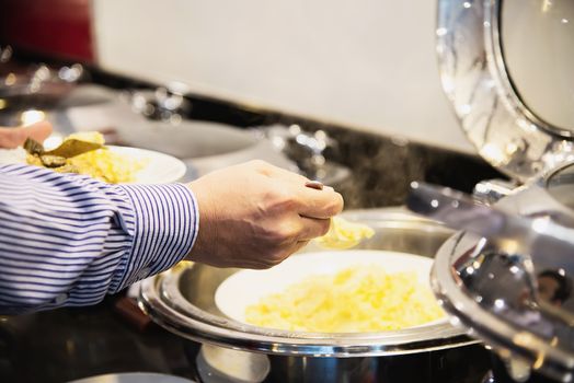 Business man eat the breakfast set in a hotel - people with breakfast in hotel concept