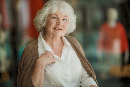 Portrait of beautiful senior woman in a shopping center