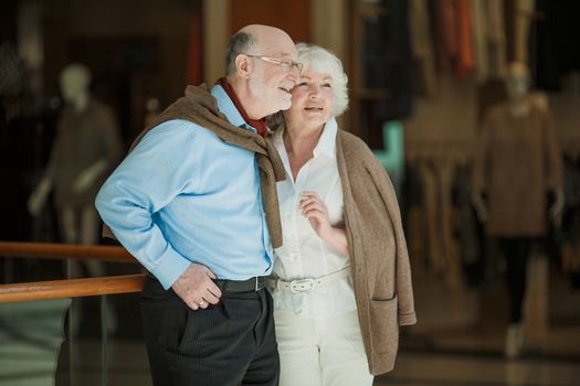Portrait of beautiful senior couple in a shopping center