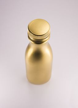 Gold plastic bottle. Clean pattern for packaging design