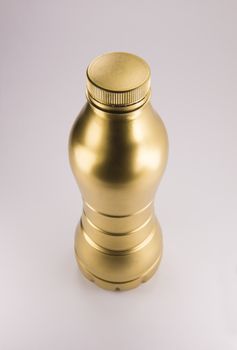 Gold plastic bottle. Clean pattern for packaging design