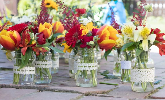 Making small flower bouquets for a wedding, Romania